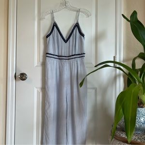 Blue stripped jumpsuit, lined and embroidered detailing. It’s giving Greece